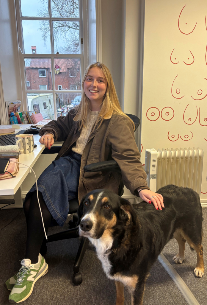 Anya at her desk at Little Lifts HQ with office dog Myrty