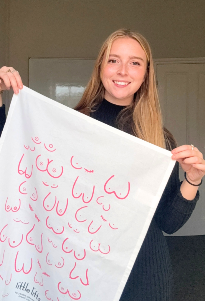 Anya with her breast cancer tea towel design
