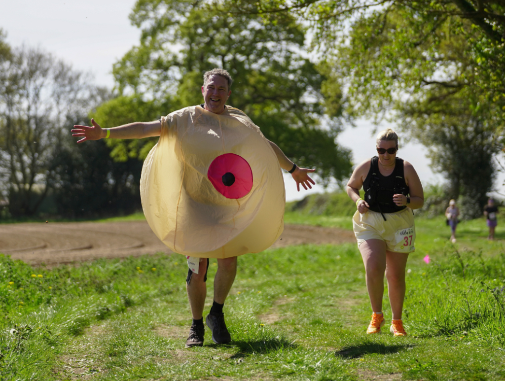 Breast cancer charity supporter on trail run route