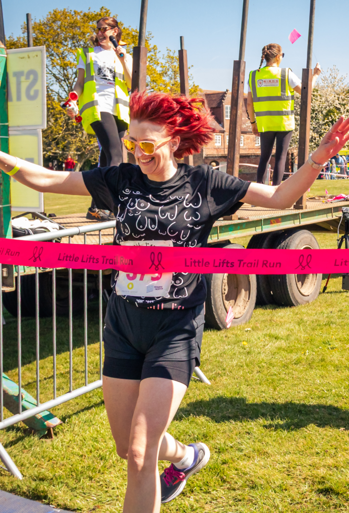 Breast cancer charity t-shirt at event finish line