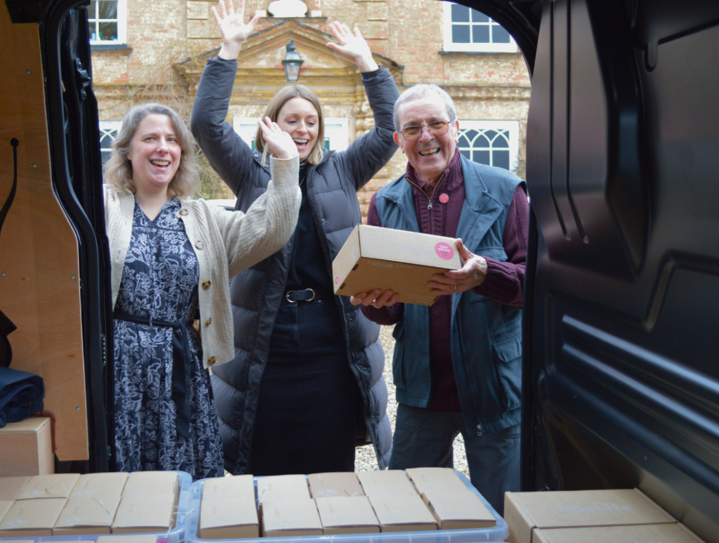 Breast cancer charity team and volunteer with 40000th Gift Box