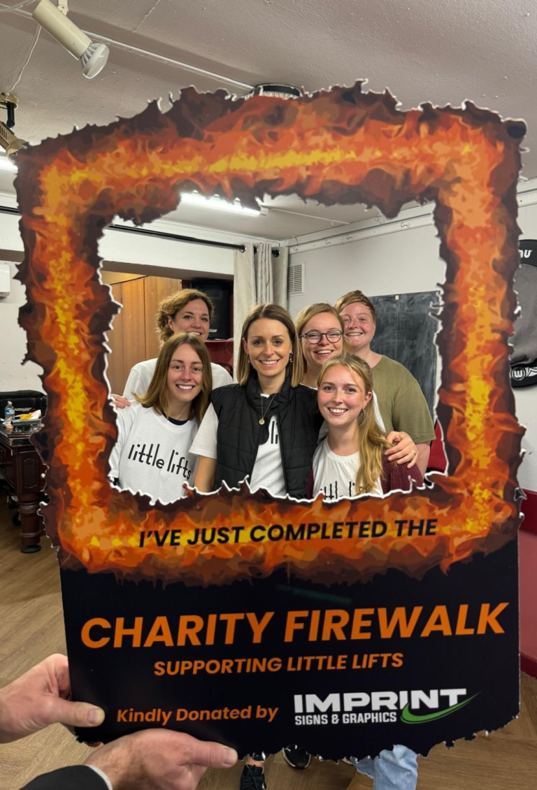 Breast cancer charity team at firewalk fundraising event