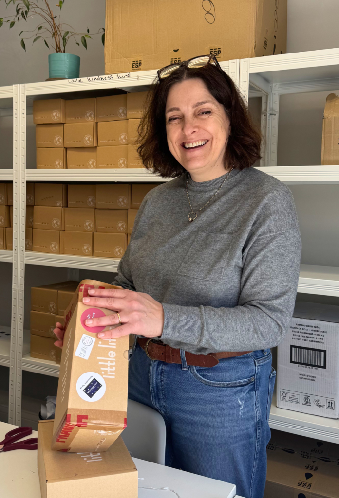 Breast cancer charity volunteer Lynne packing gift Boxes