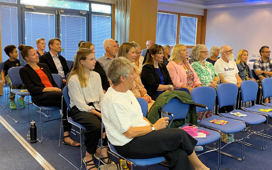 Breast cancer charity volunteer appreciation awards seated