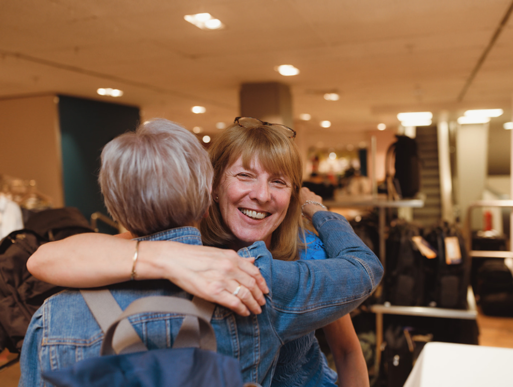 Breast cancer charity volunteers before fashion show