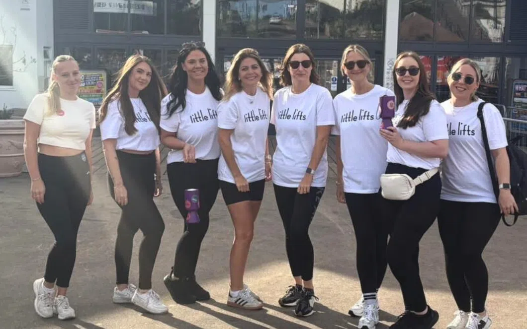 Corporate fundraising team in breast cancer charity t-shirts