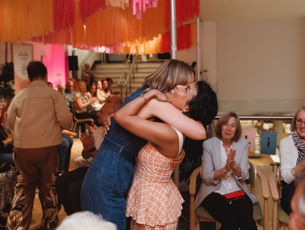 Event speaker and Founder Oa hugging