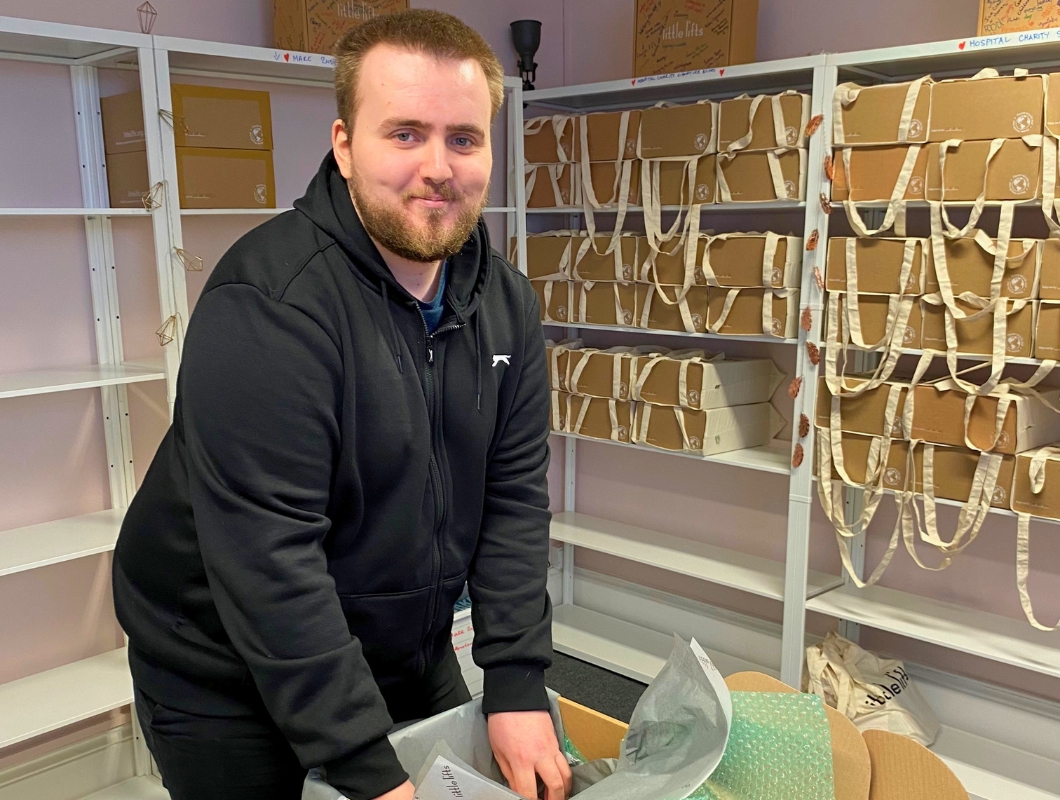 George standing in the packing room, filling a Little Lifts Box