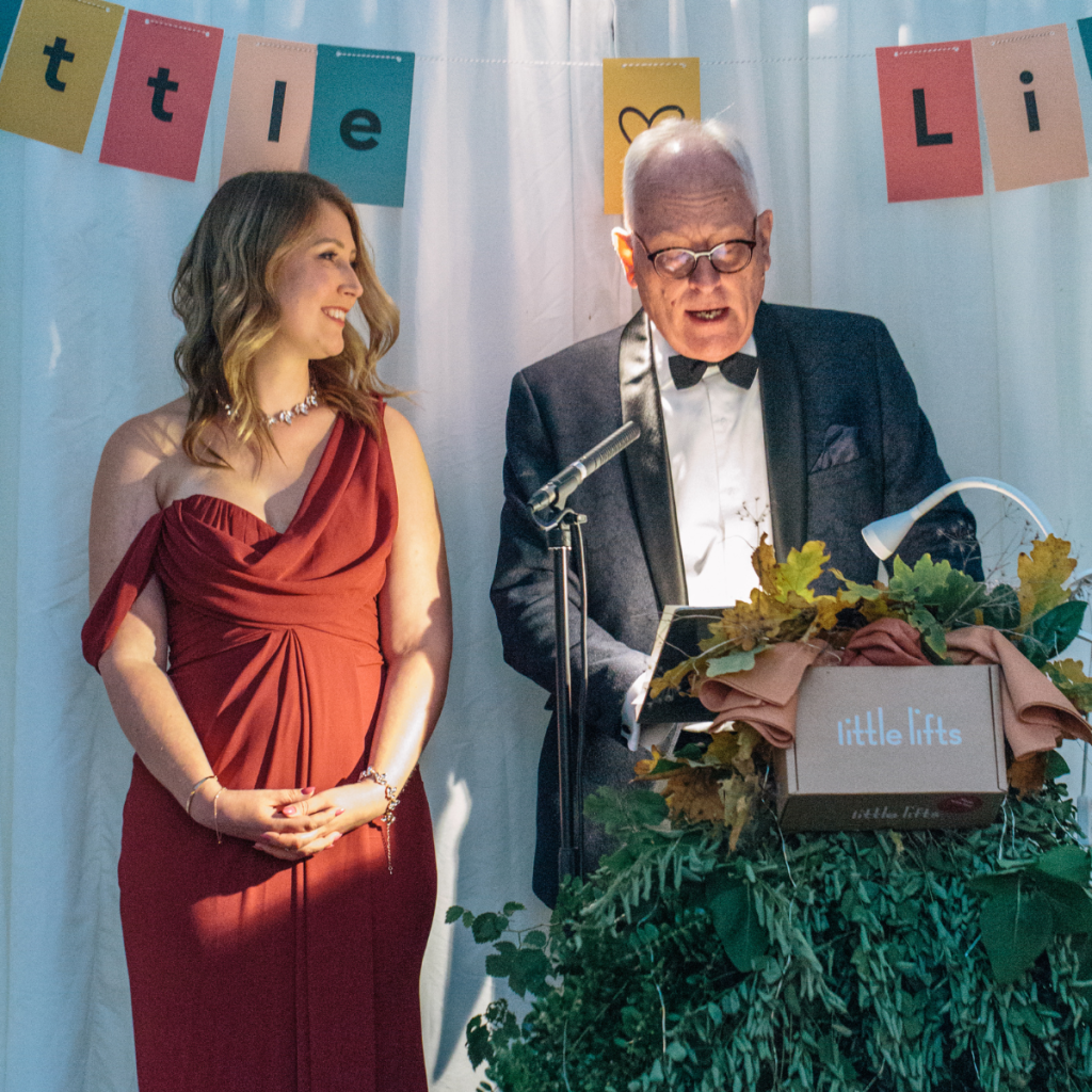 breast cancer charity volunteers speaking at fundraising ball
