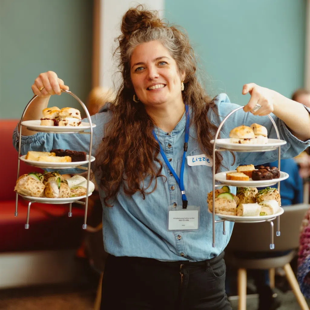 Breast cancer charity team member at a community club event