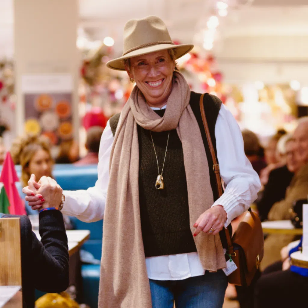 Breast cancer charity gift box beneficiary modelling in fashion show