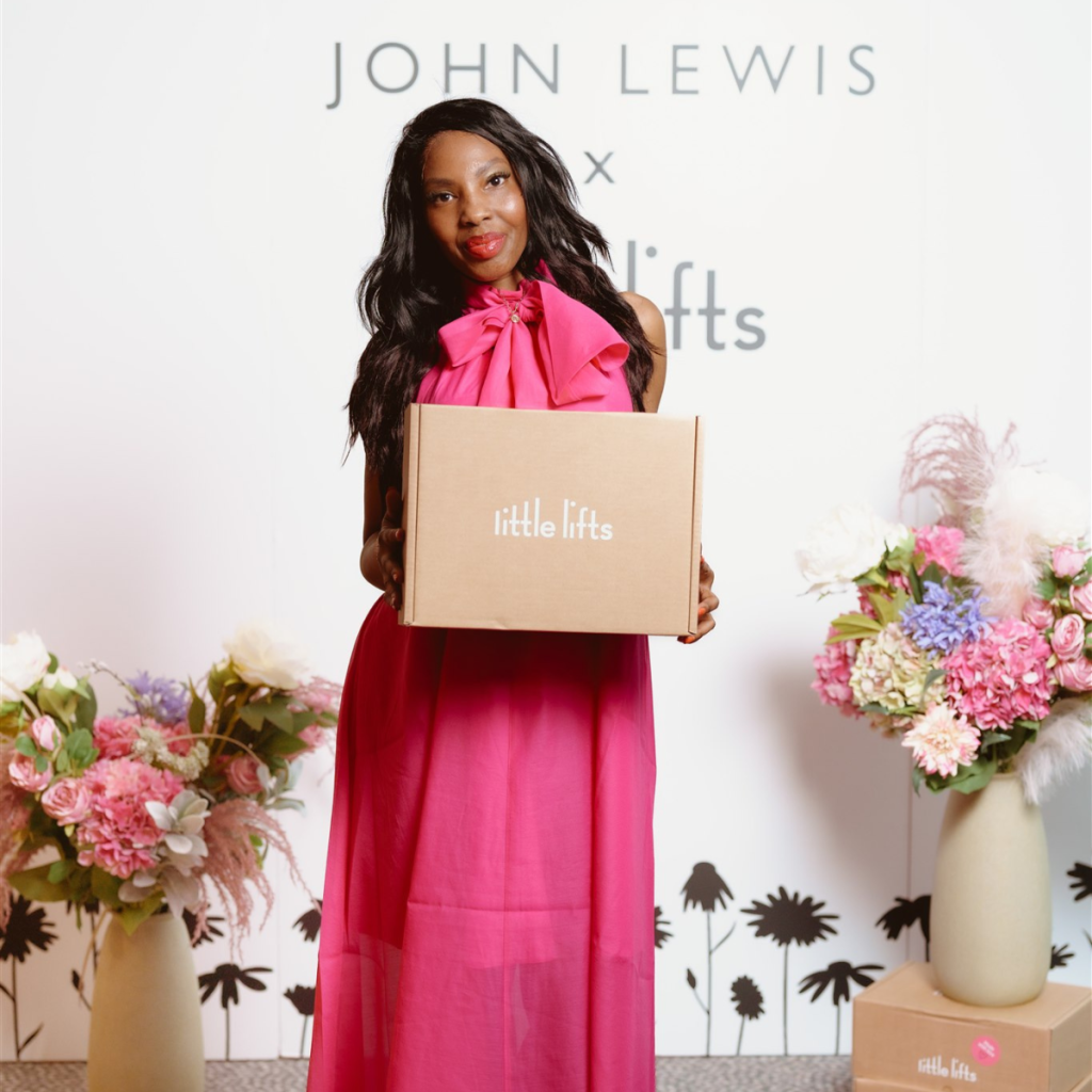 Breast cancer charity gift box beneficiary modelling in fashion show