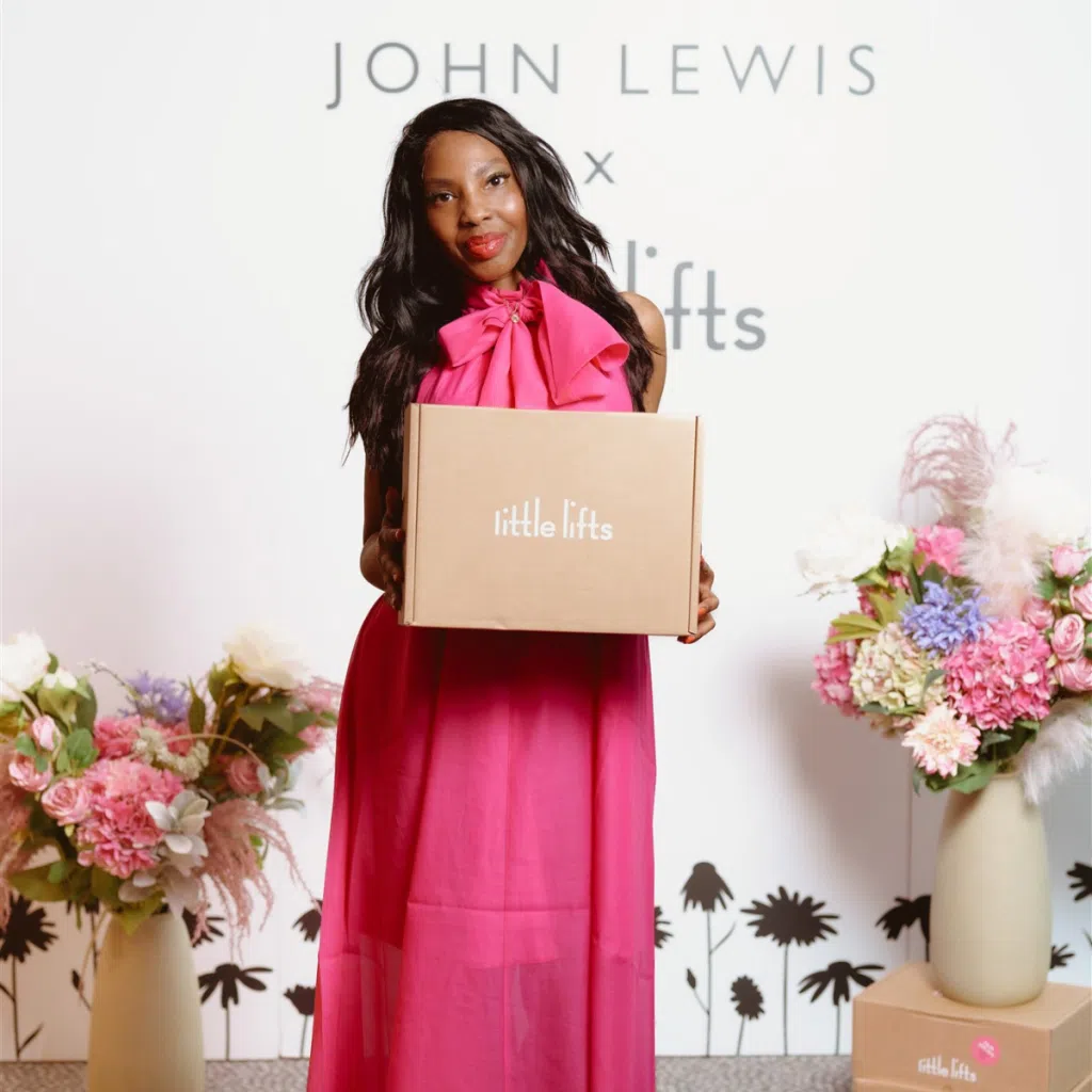 Breast cancer charity gift box beneficiary modelling in fashion show