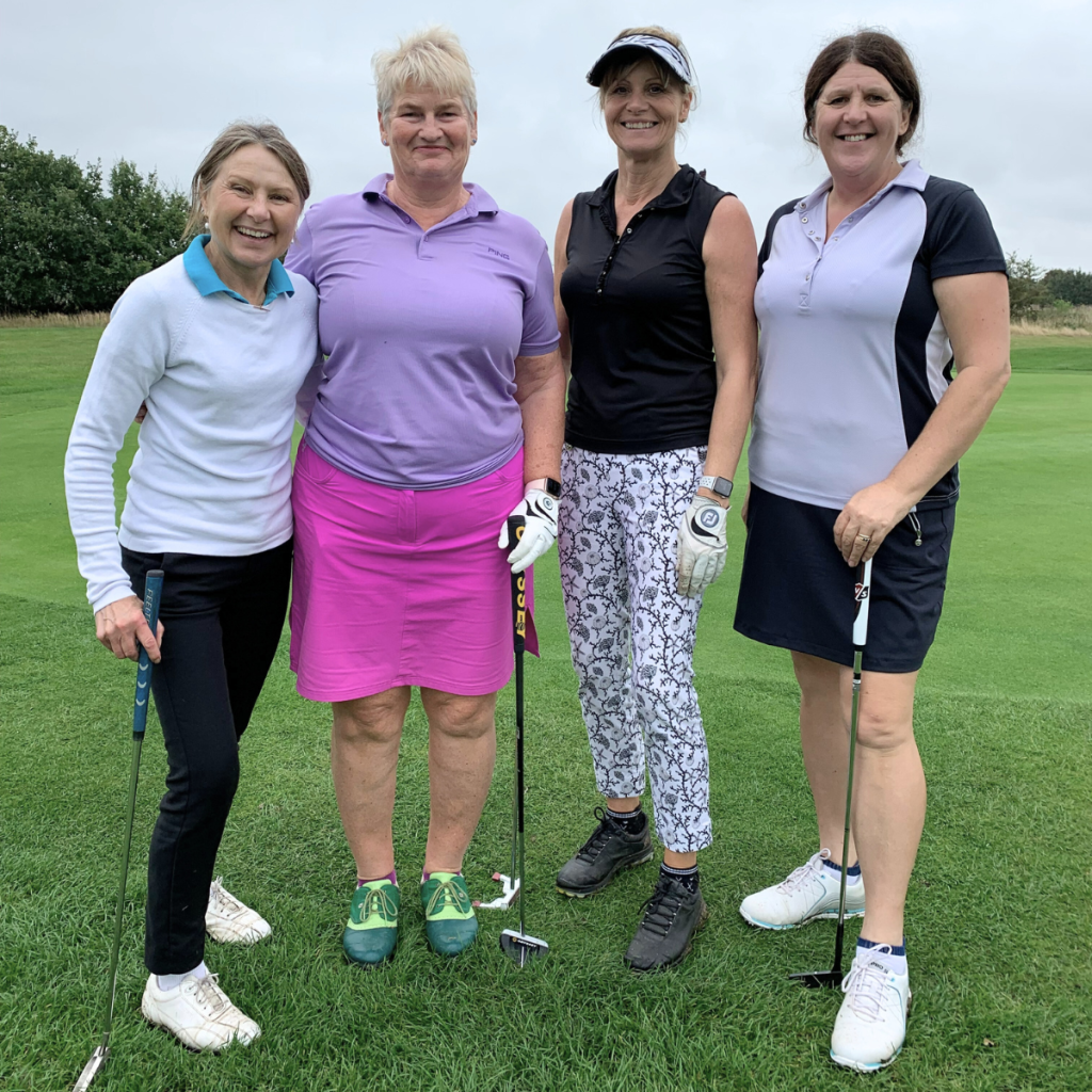Breast cancer charity supporters at annual golf day fundraising event