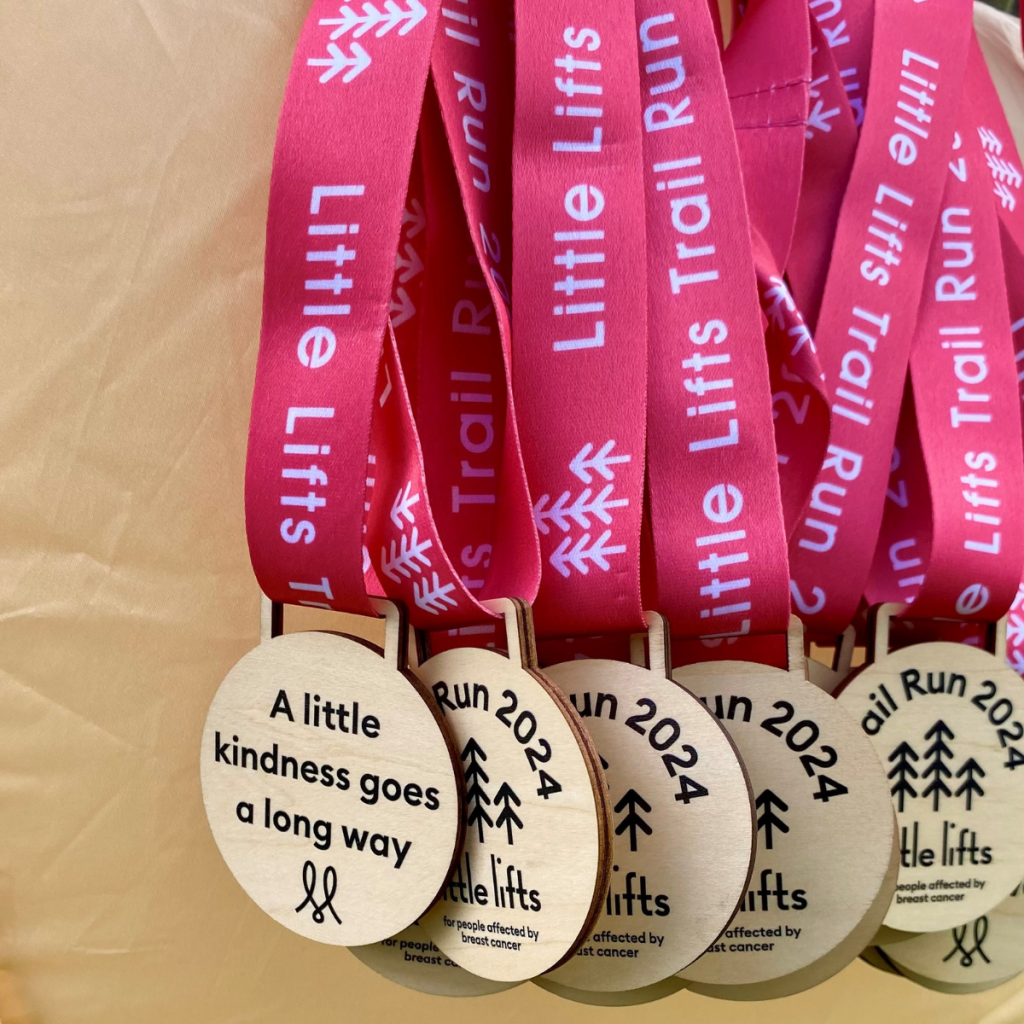 Trail Run event raising funds for people affected by breast cancer medals