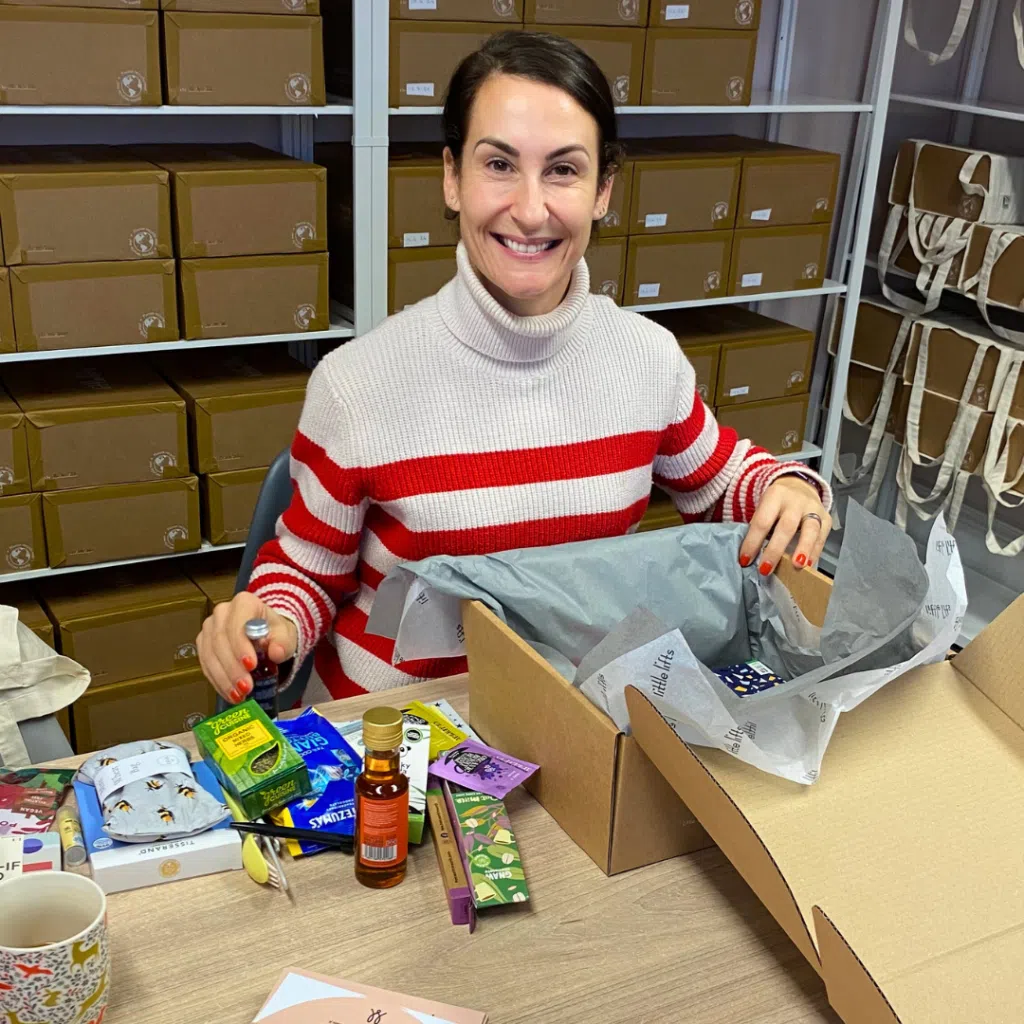 breast cancer charity volunteer Amy packing gift Boxes