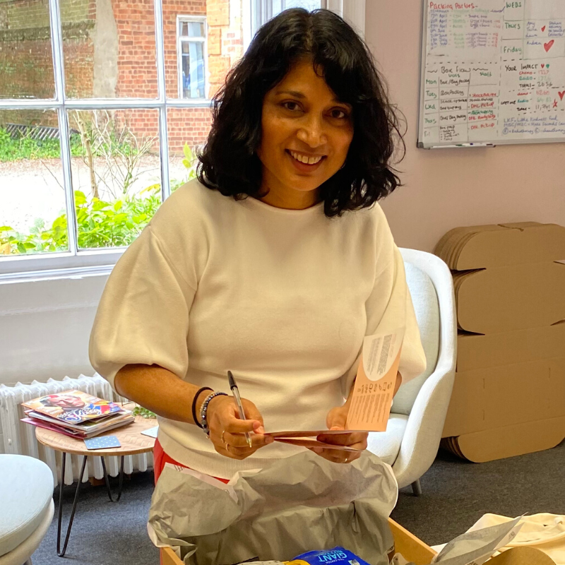 breast cancer charity volunteer Sharon packing gift Boxes