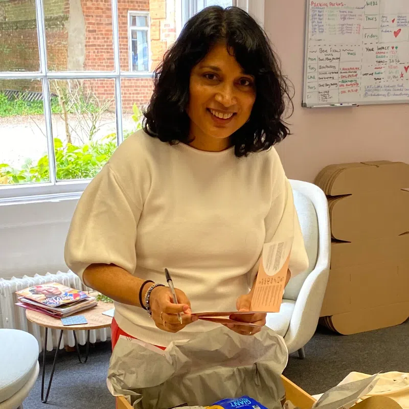 breast cancer charity volunteer Sharon packing gift Boxes