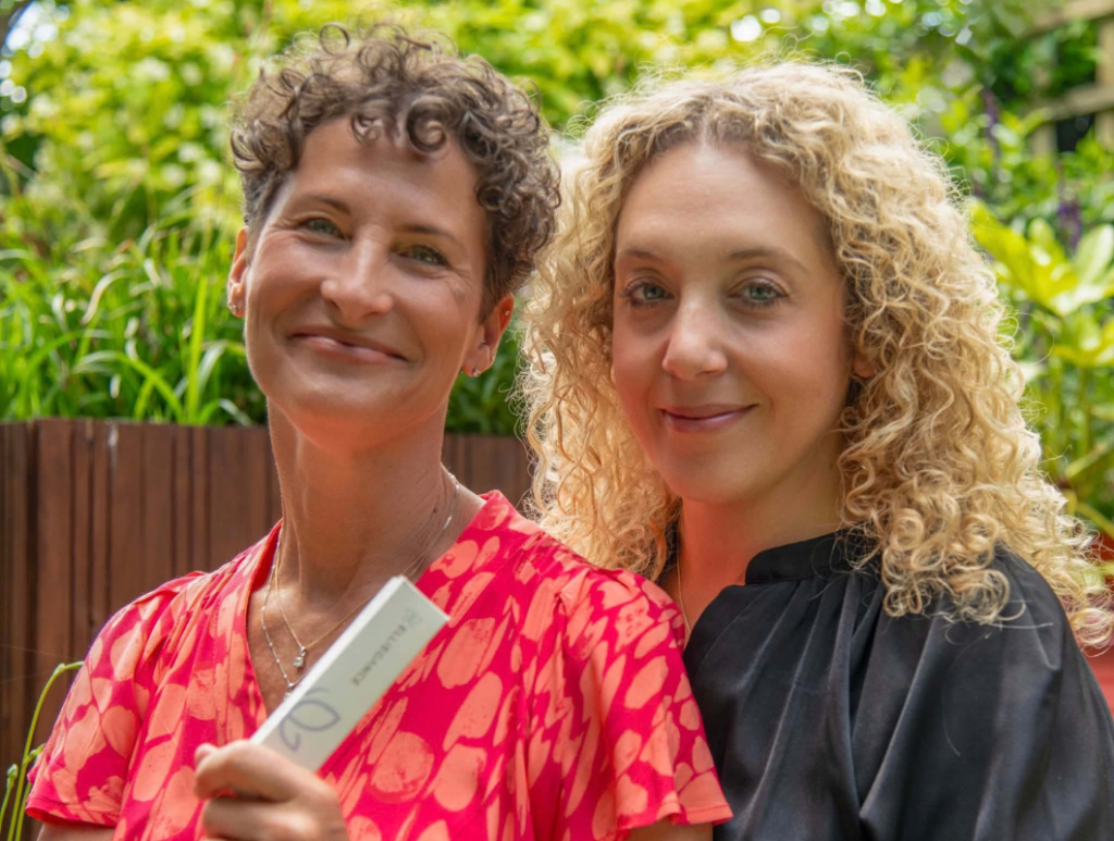 Hannah and her friend smiling after setting up their own business