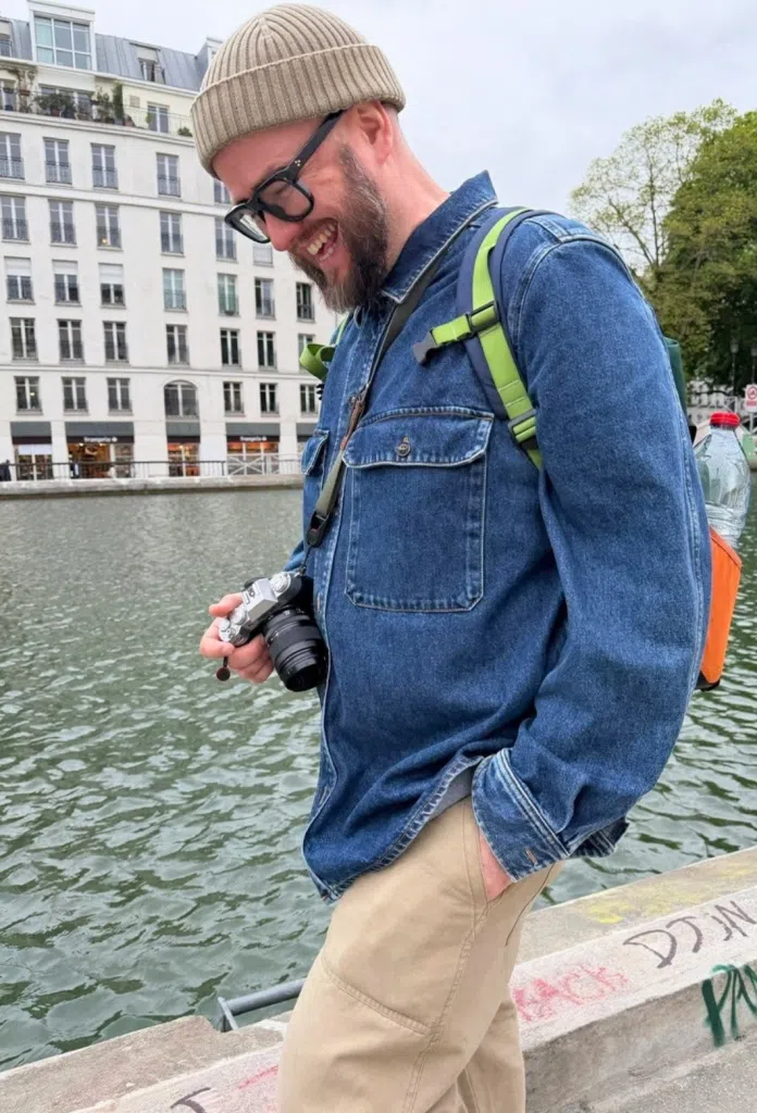 james smiling and walking along river during treatment for male breast cancer